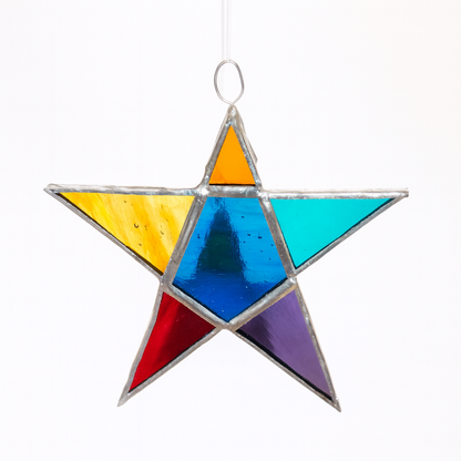 Colorful stained glass star hanging on a white background